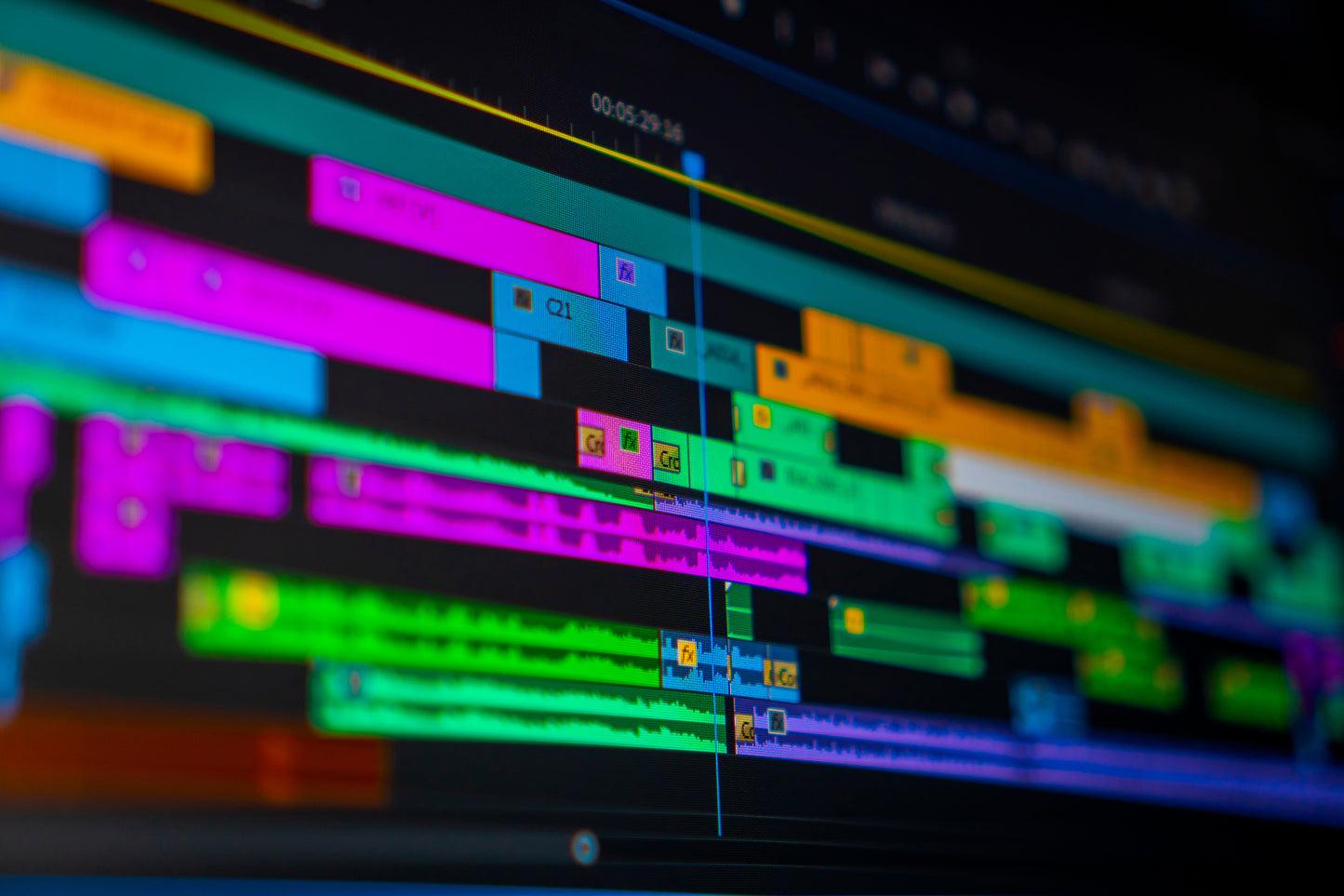 A colorful representation of a video editing software interface, showcasing various video clips and editing tools.